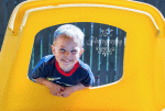 Photo of boy in yellow window.