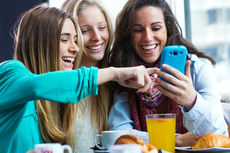 3 women enjoying friendships, taking a selfie.