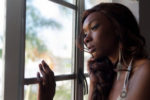 Sad woman looking out window