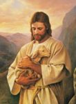 Jesus tenderly holding a little lamb: backdrop mountains
