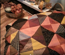 quilted pillow on table