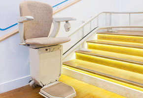 automatic stair lift by yellow stairs