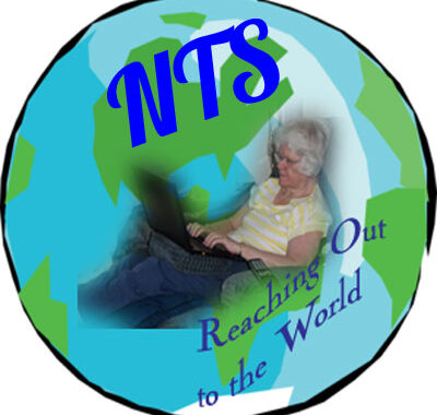 Graphic of round globe, blue seas, green cotntinents. Picture of Carole in recliner using laptop superimposed on globe. "Reaching out to the world".