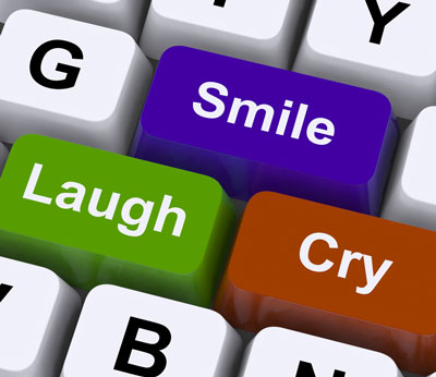 Typewriter keyboard with 3 keys replaced by the words, "Smile, Laugh, Cry".