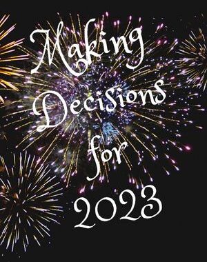 "Making decisions for 2023" written on fireworks on black background.